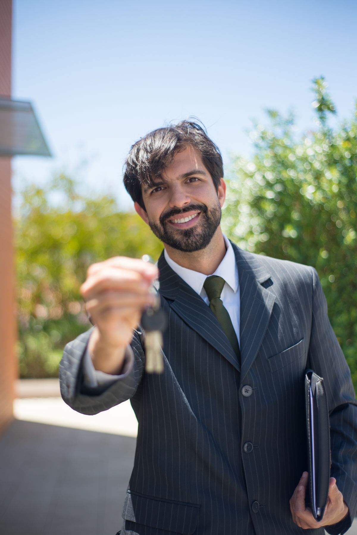 A letting agent handing over keys to a new tenant